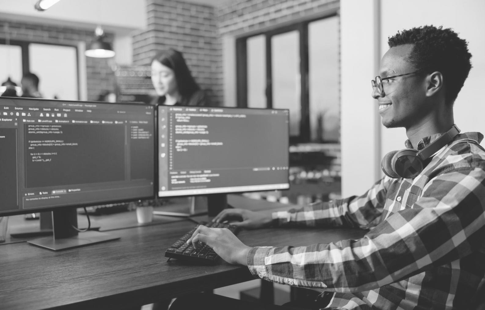 Advanced blockchain development environment with multiple monitors showing code