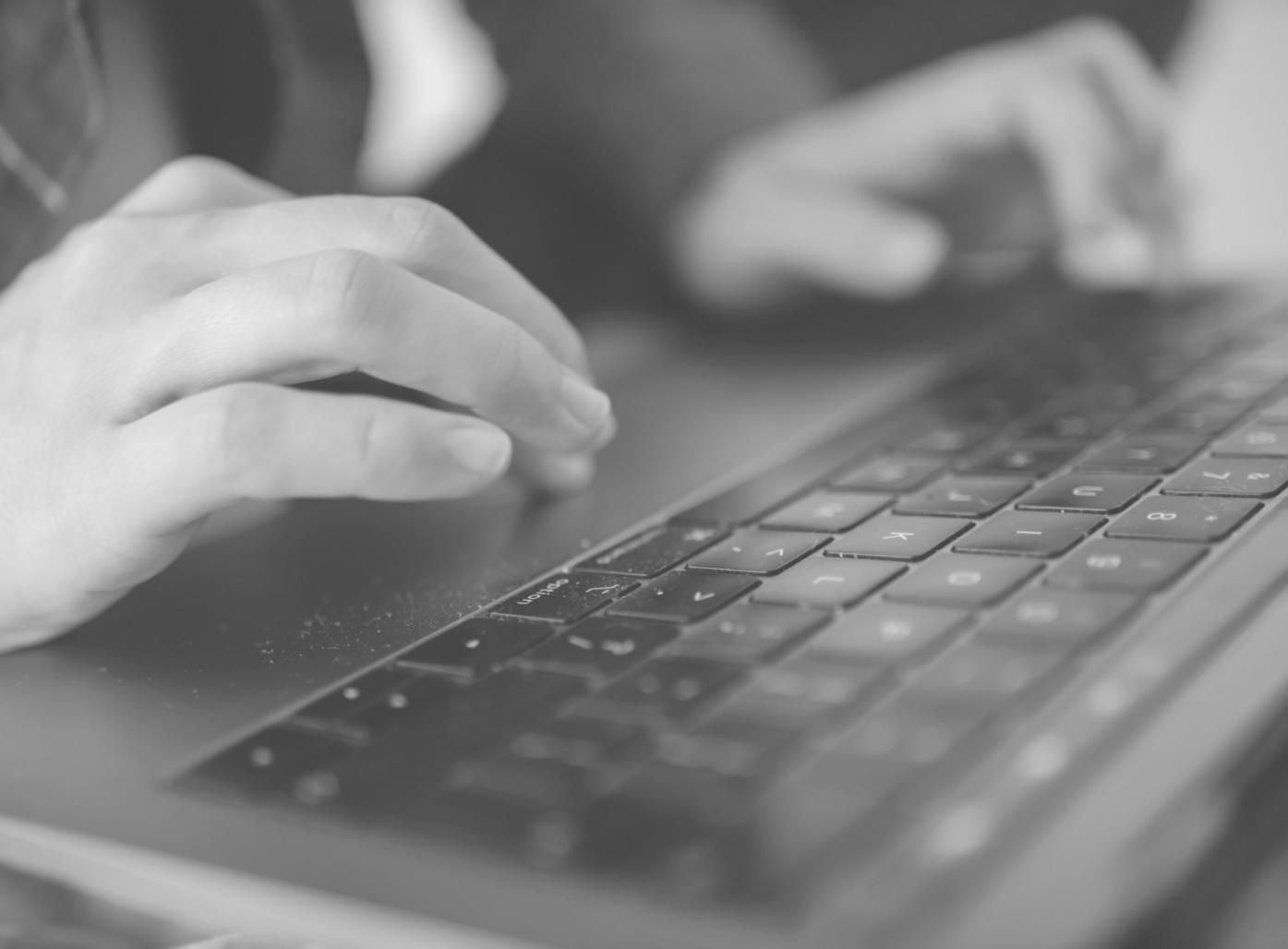 Students working on NFT development projects in collaborative learning environment